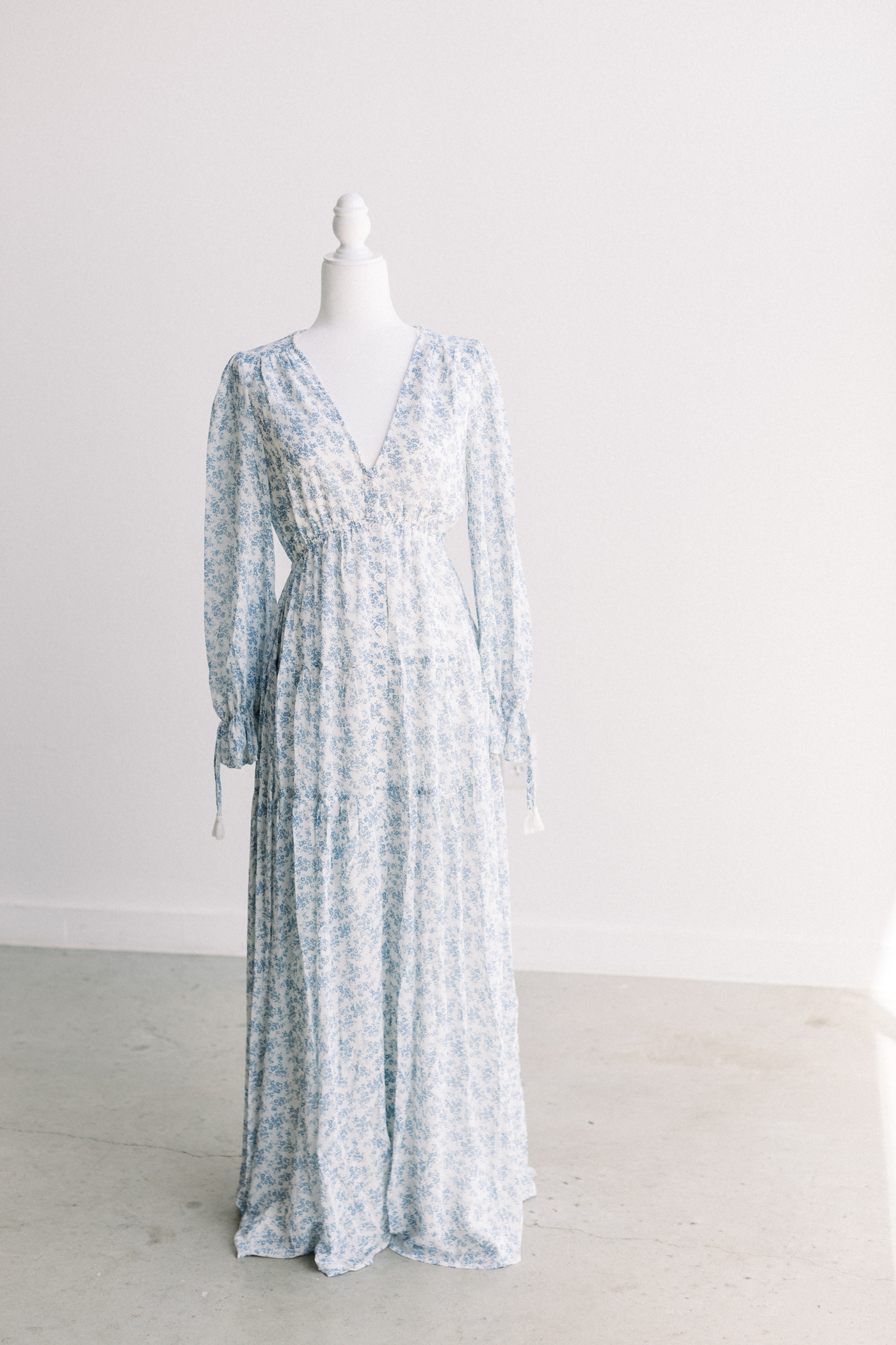 Blue and white floral maxi dress with sleeves provided by the Sana Ahmed Photography Client Wardrobe.
