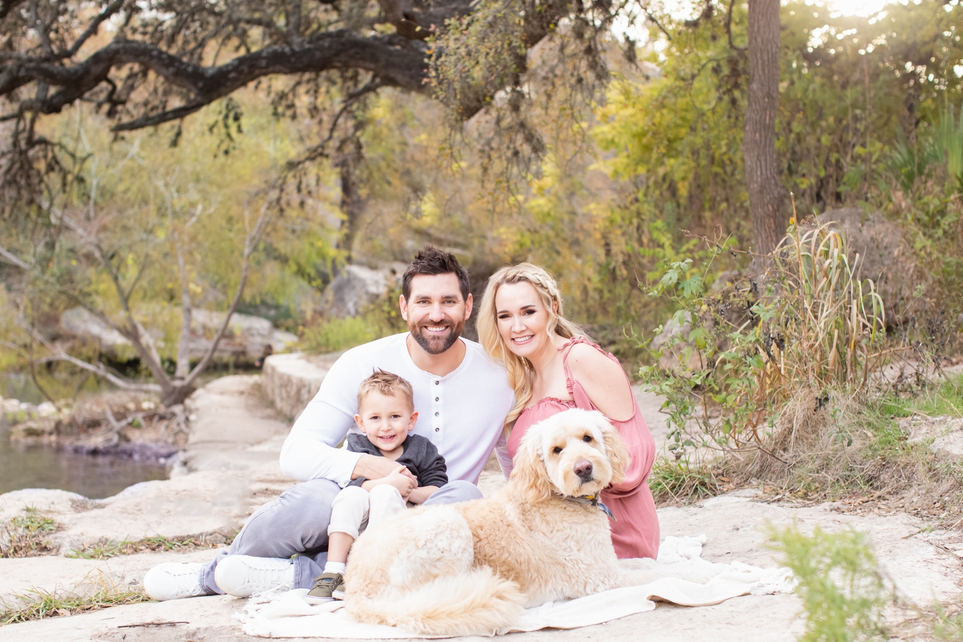 Family session in beautiful Austin TX park with dog. Photo by Sana Ahmed Photography.