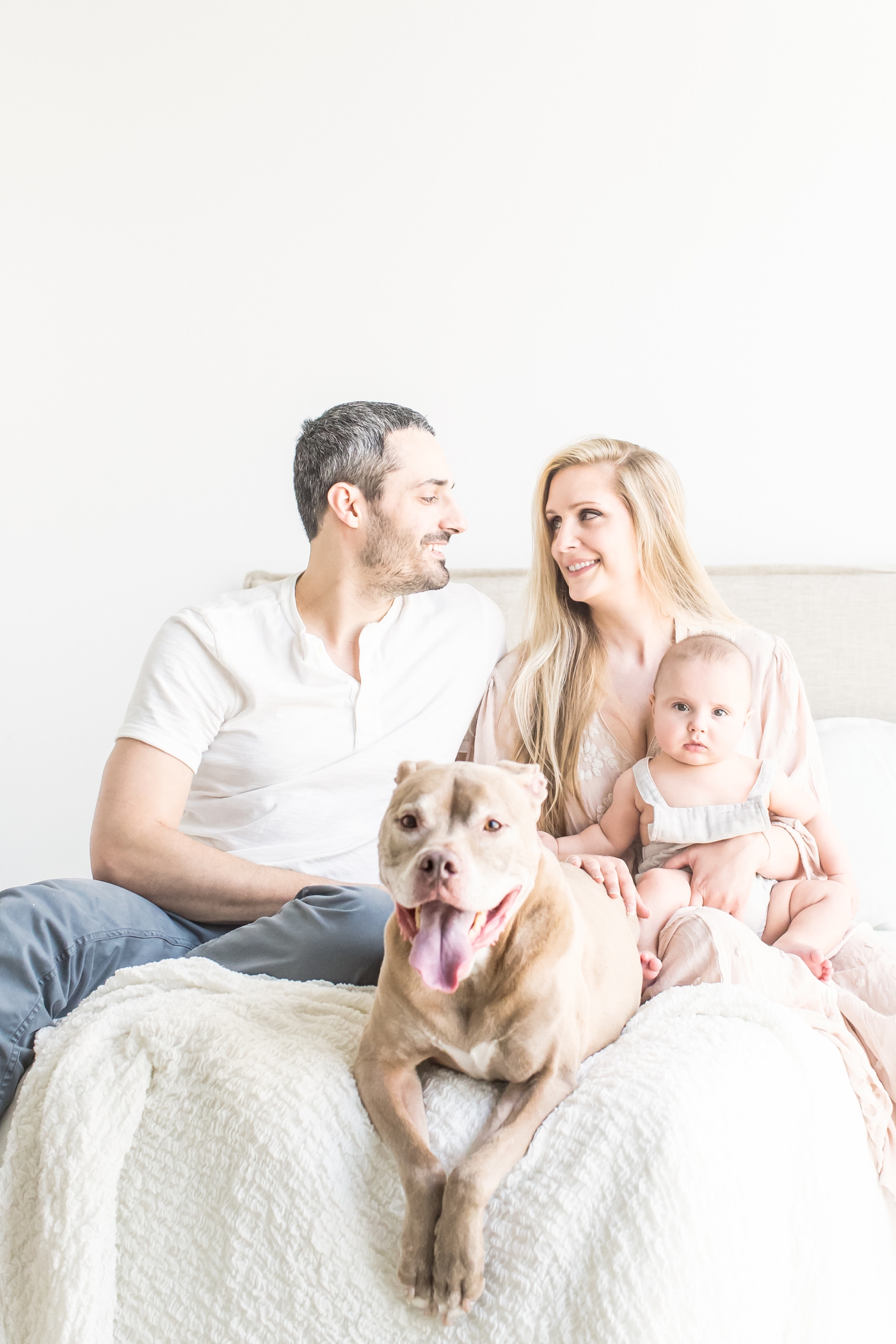 Family session with dog in Austin, TX studio. Photo by Sana Ahmed Photography.