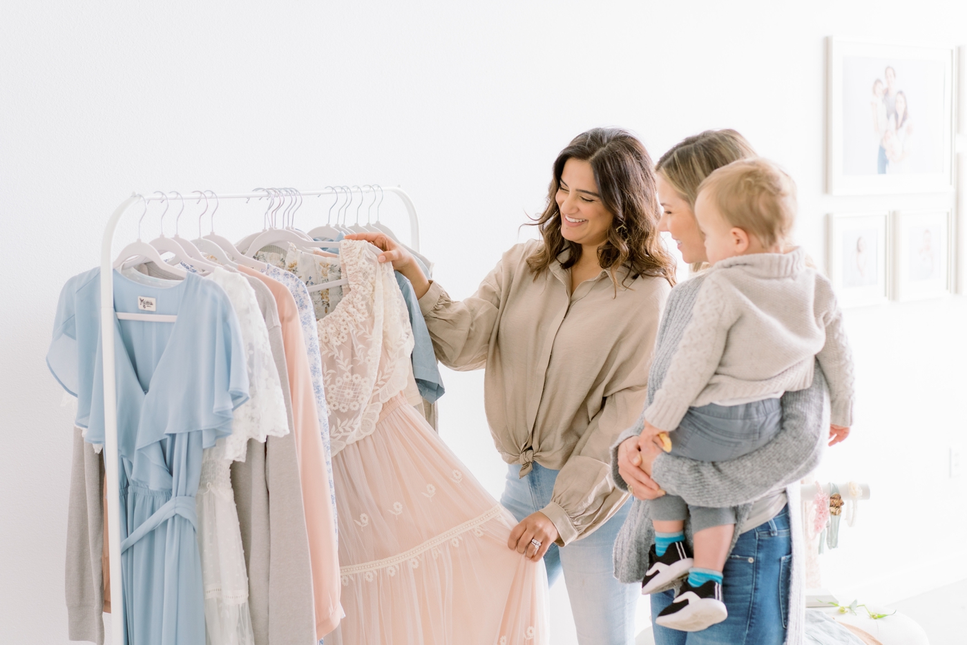 Mom with child selecting what to wear from the Client Wardrobe with Austin TX family photographer, Sana Ahmed Photography.