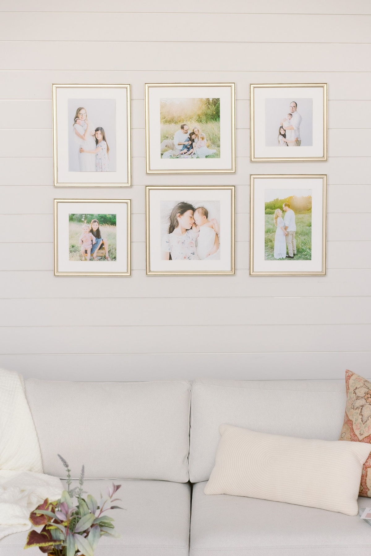 Stunning gallery wall design with gold frames and white mat by Sana Ahmed Photography.