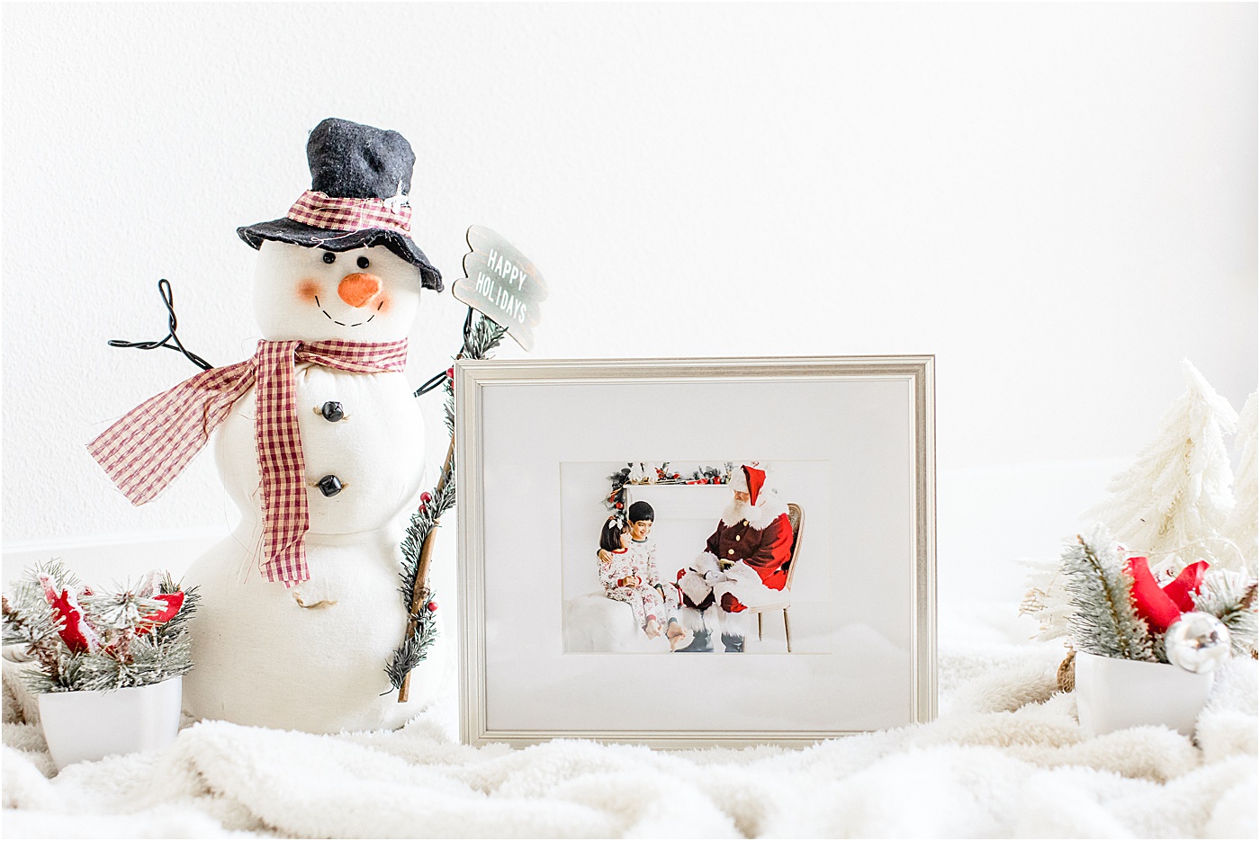 Custom wood frame with image of Santa with children. Photo by Sana Ahmed Photography.