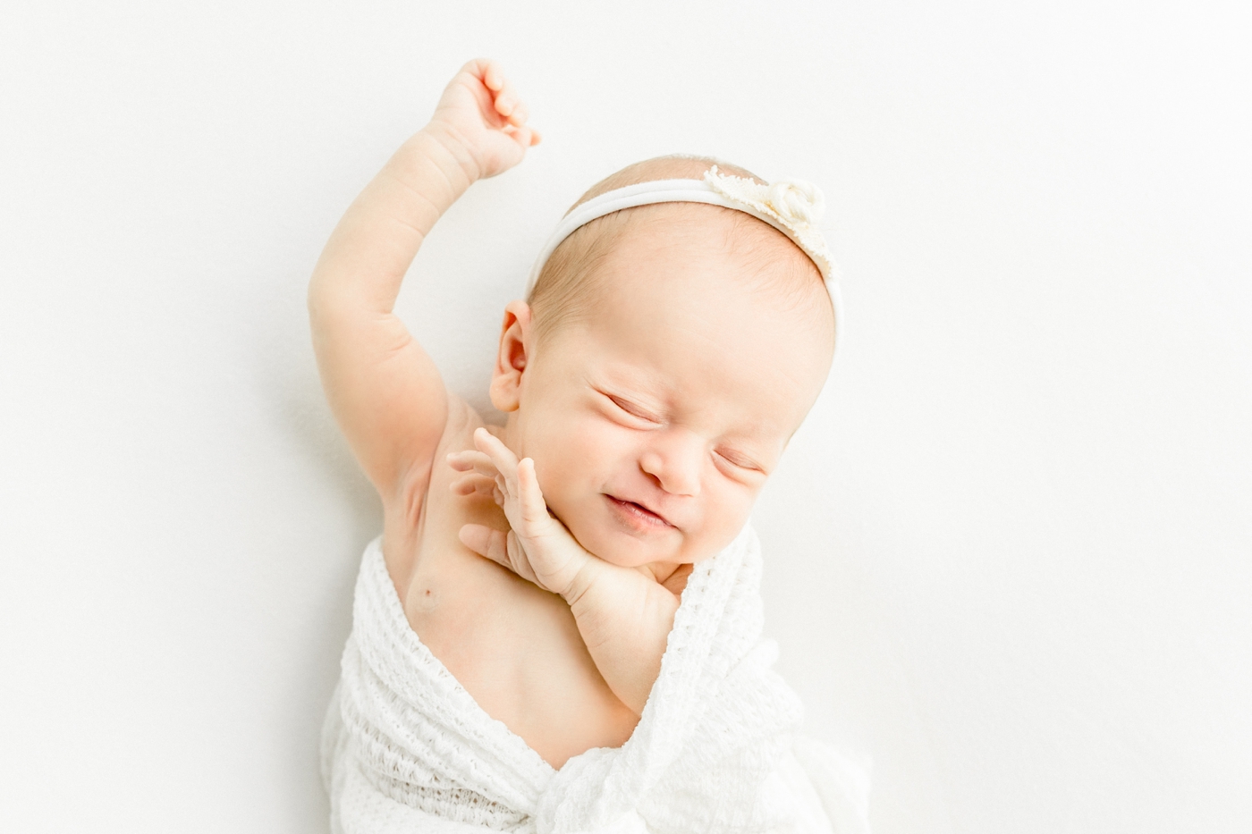 Baby stretching during newborn session in studio with Sana Ahmed Photography.