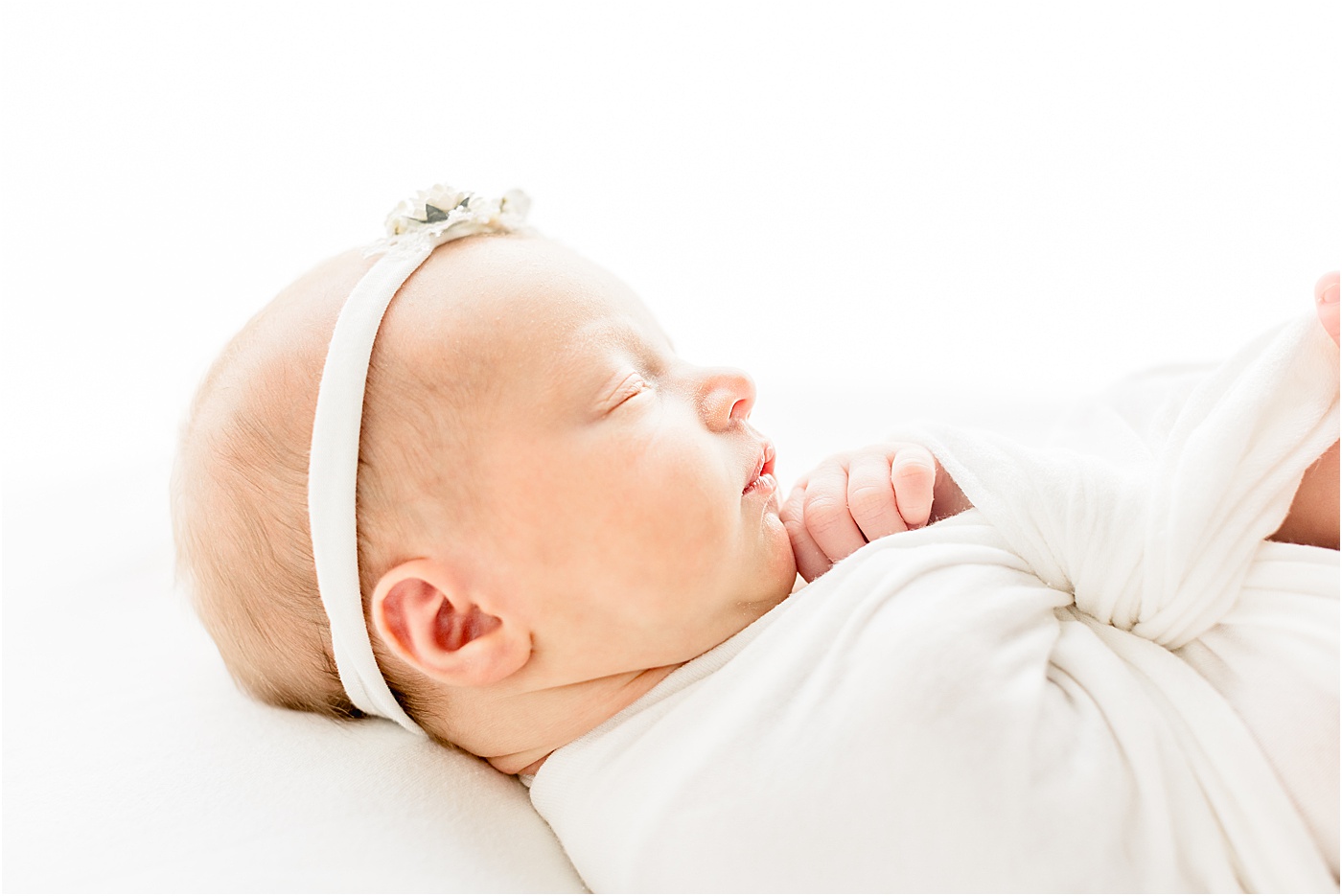 Profile image of baby girl during newborn studio session in Austin with Sana Ahmed Photography.