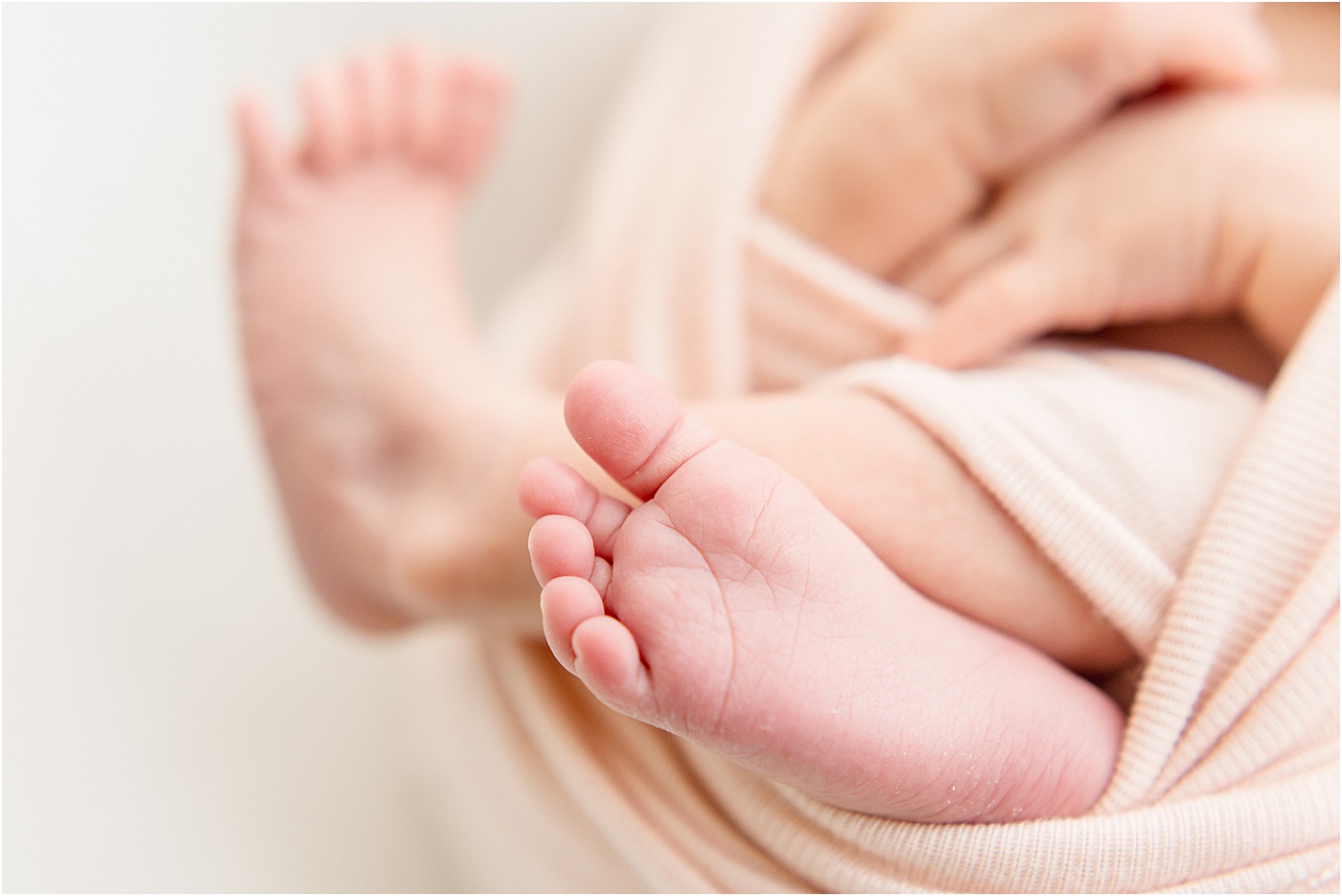 Closeup of baby's feet by Sana Ahmed Photography.