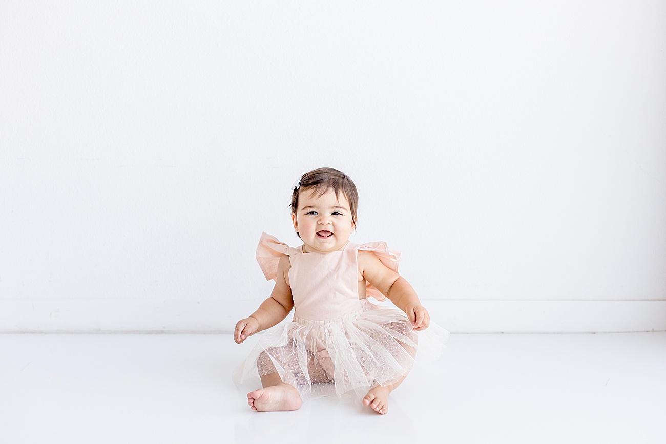 Happy baby during One Year milestone portraits in Austin, TX studio with Sana Ahmed Photography.