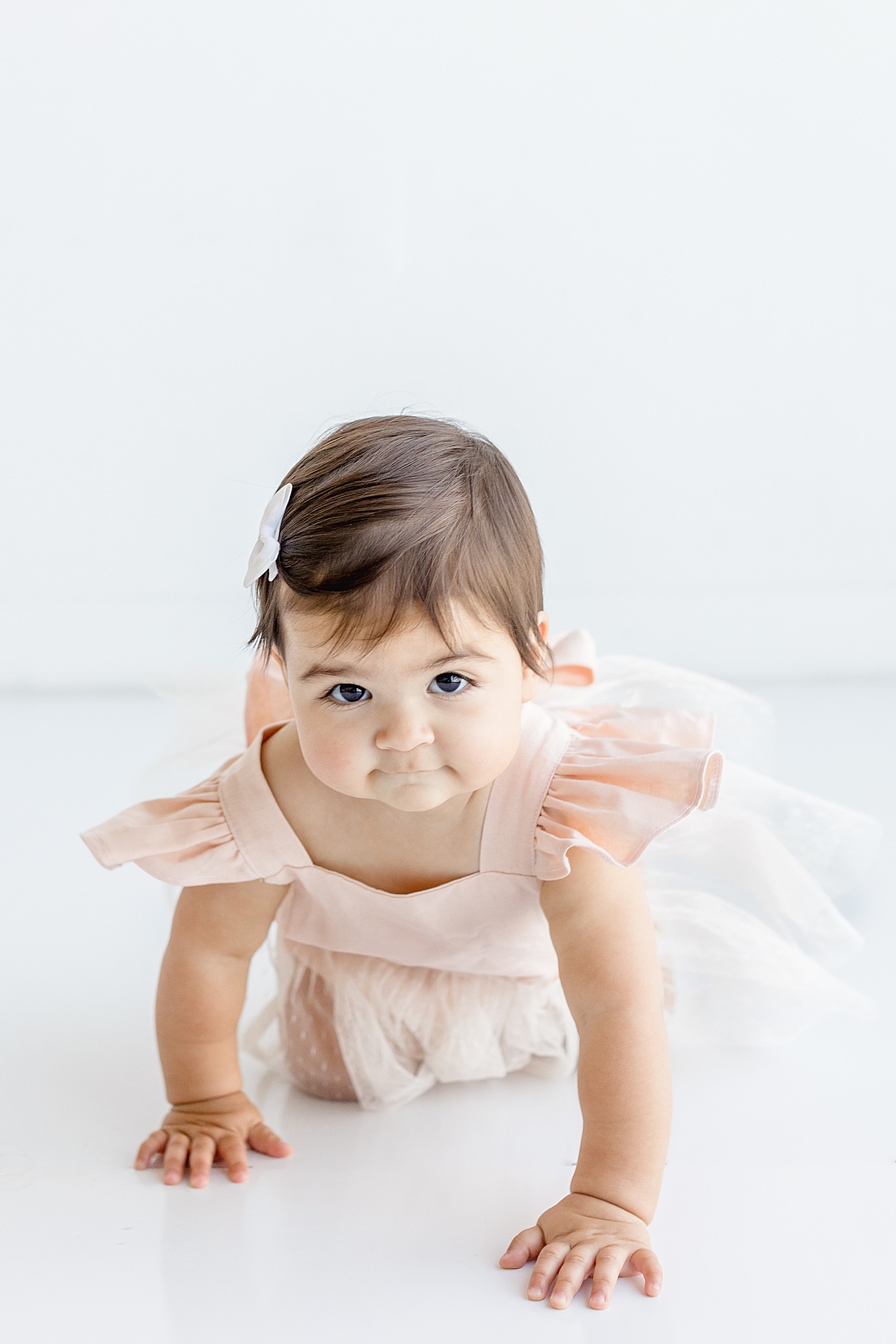 One year old crawling in Austin, TX studio. Photo by Sana Ahmed Photography