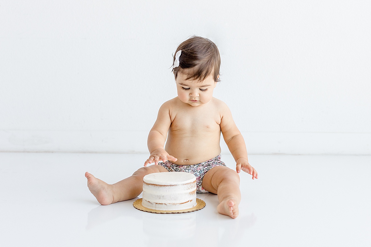 Classic cake smash photos by Sana Ahmed Photography in her Austin, TX studio.
