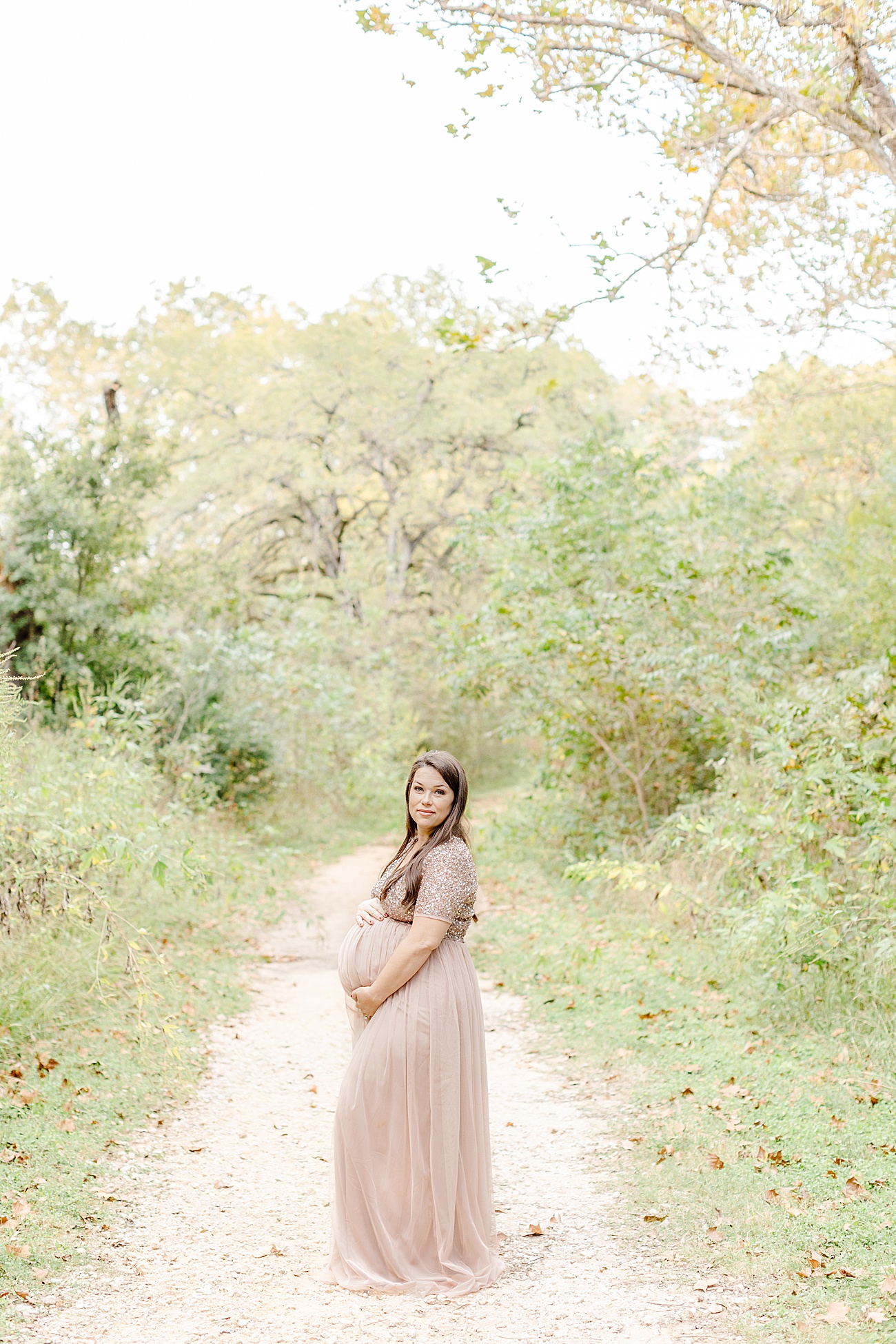 Maternity image in Austin, TX field by Sana Ahmed Photography