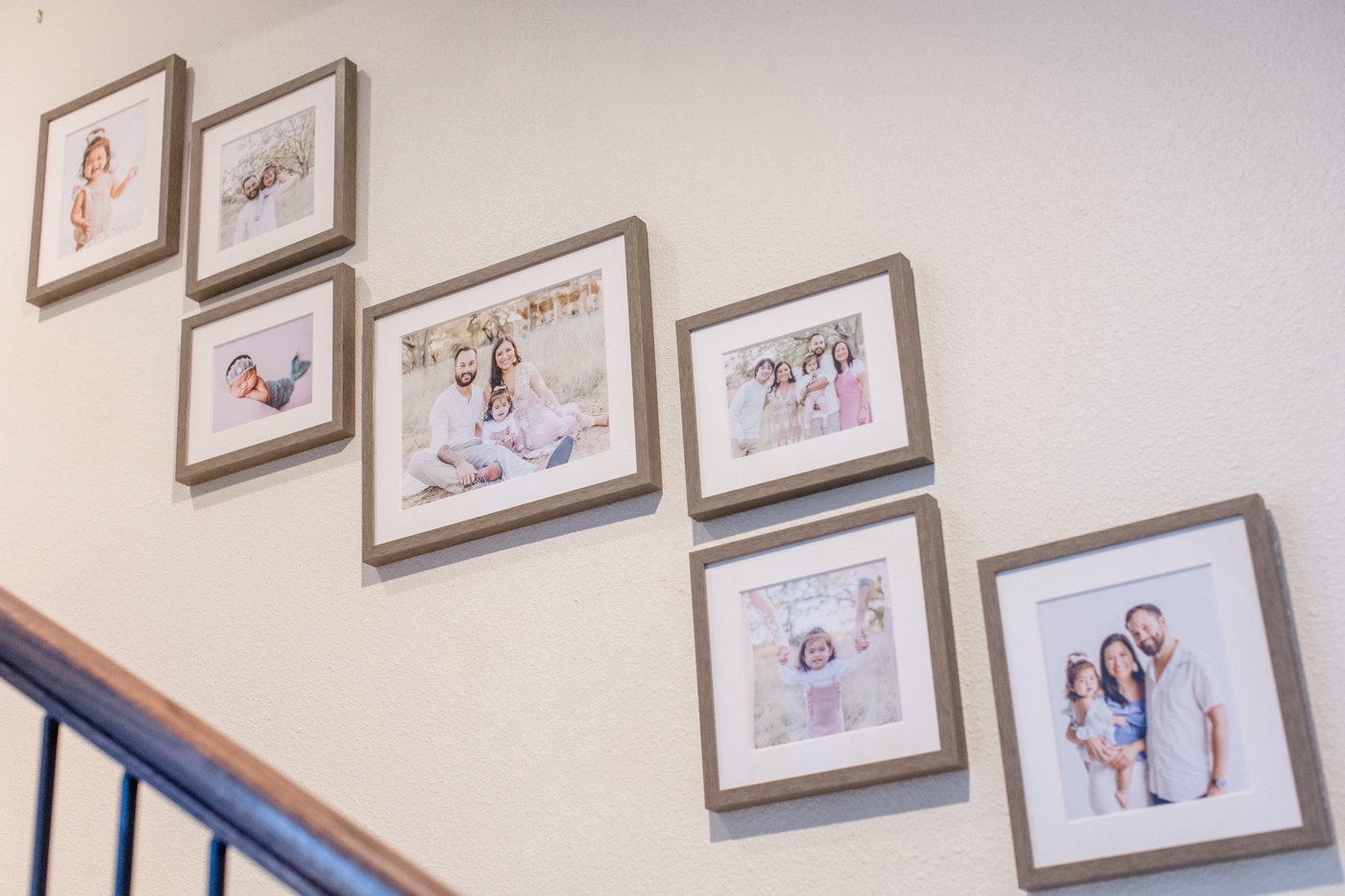 Staircase gallery wall design for family in Austin, TX. Design and photos by Sana Ahmed Photography.