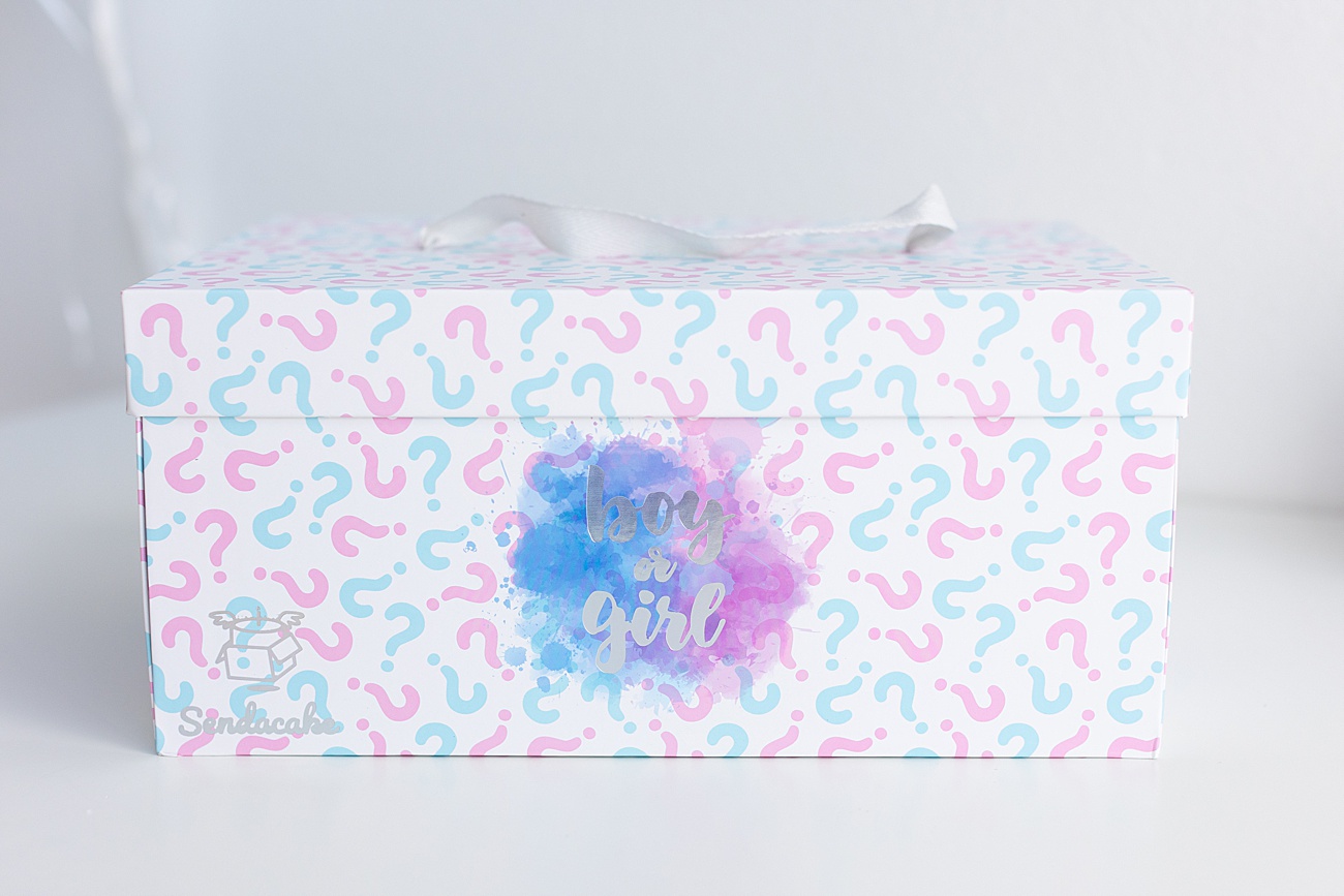 Gender reveal box with either pink or blue paper butterflies inside. Photo by Sana Ahmed Photography.