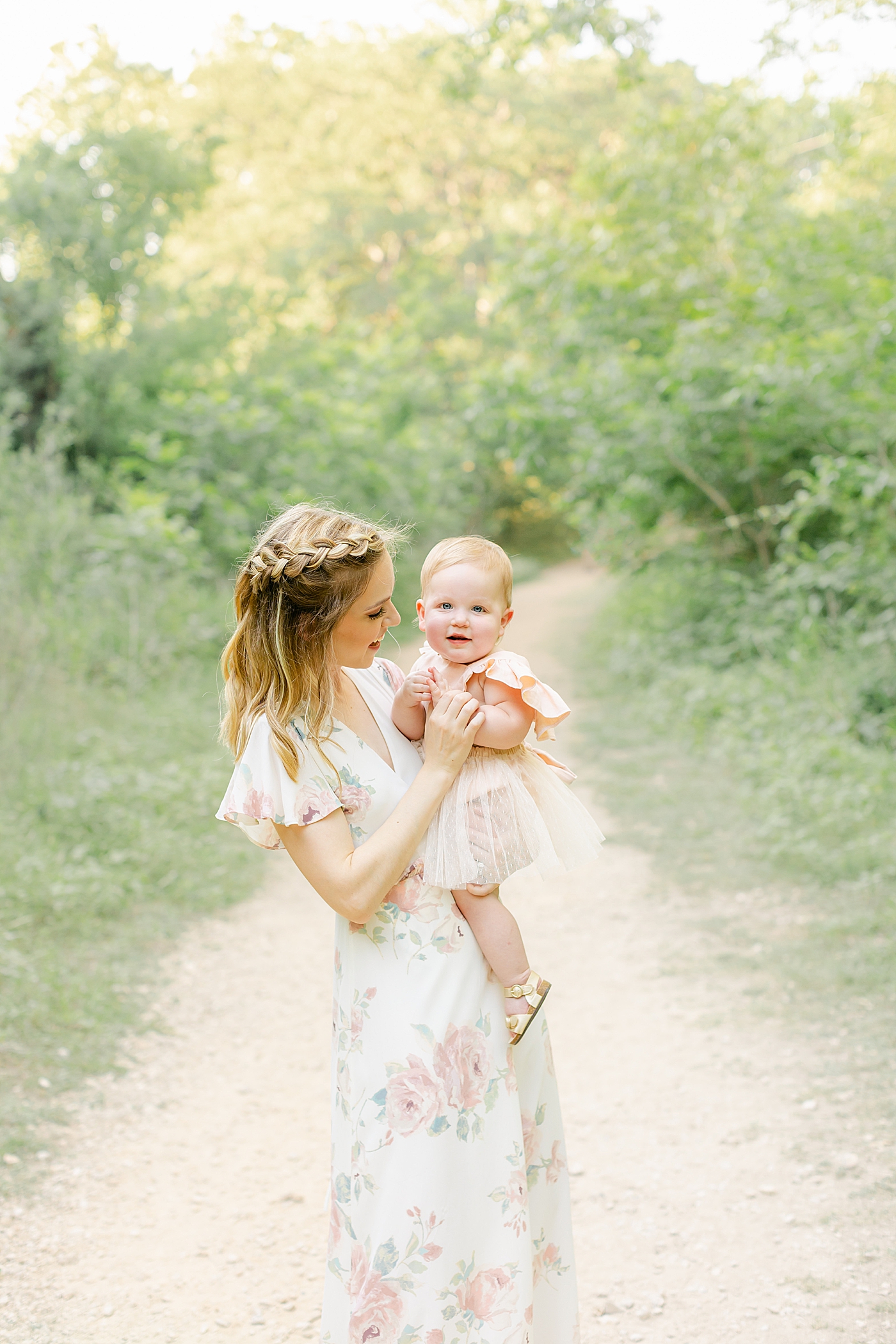 Mom in floral dress playing with her baby girl | Sana Ahmed Photography