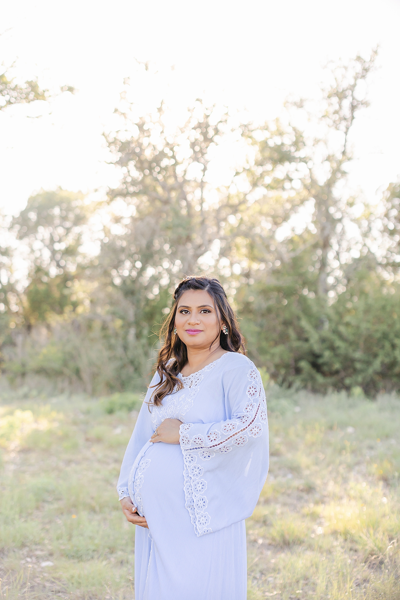 Expecting mom in blue dress during her Outdoor Maternity Session in Austin | Photo by Sana Ahmed Photography