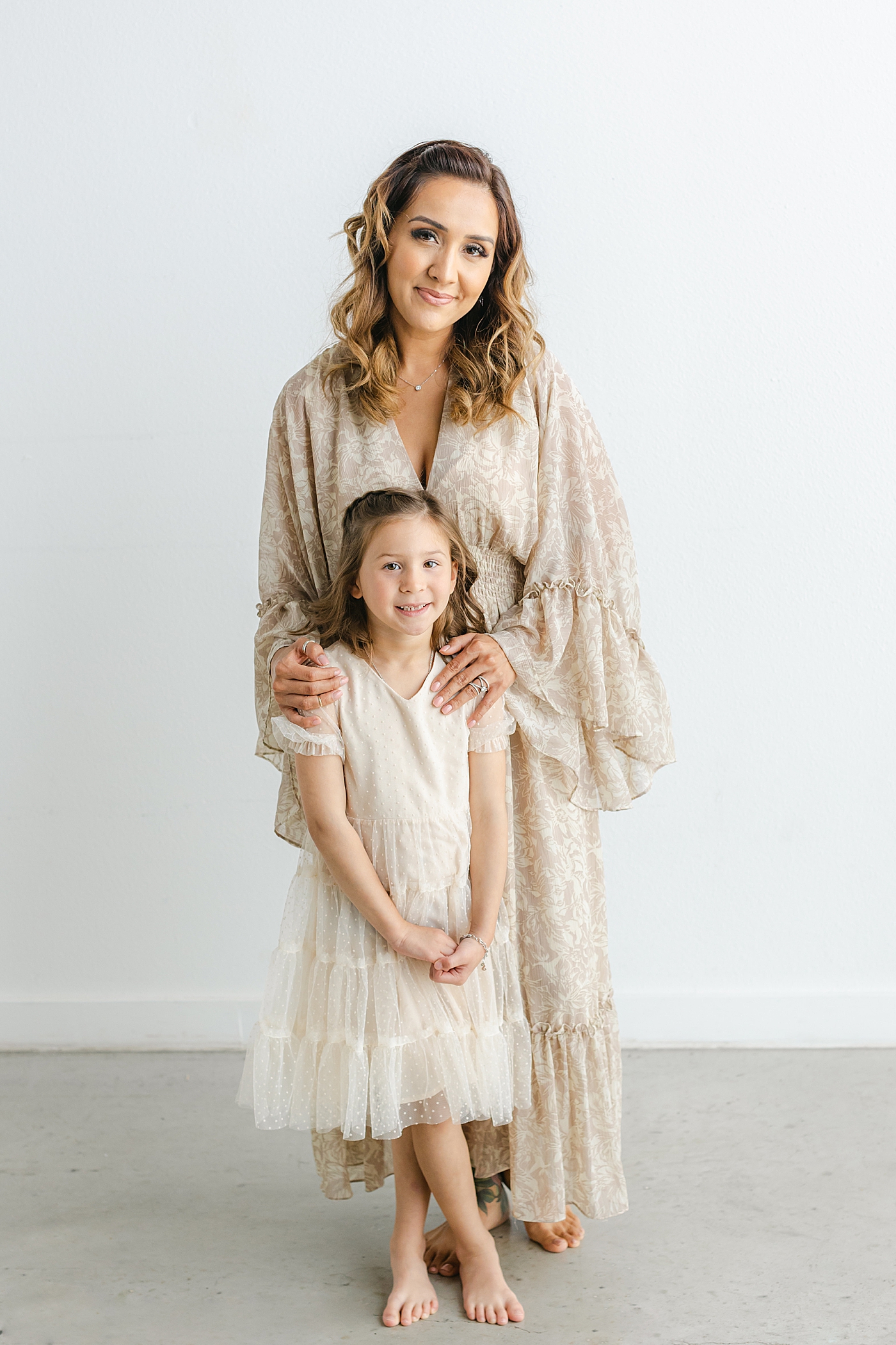 Mom standing with her daughter during their Studio Family Session in Austin | Photo by Sana Ahmed Photography