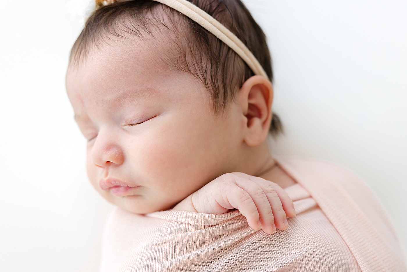 Sleeping newborn during her Austin Studio Newborn Session | Photo by Sana Ahmed Photography