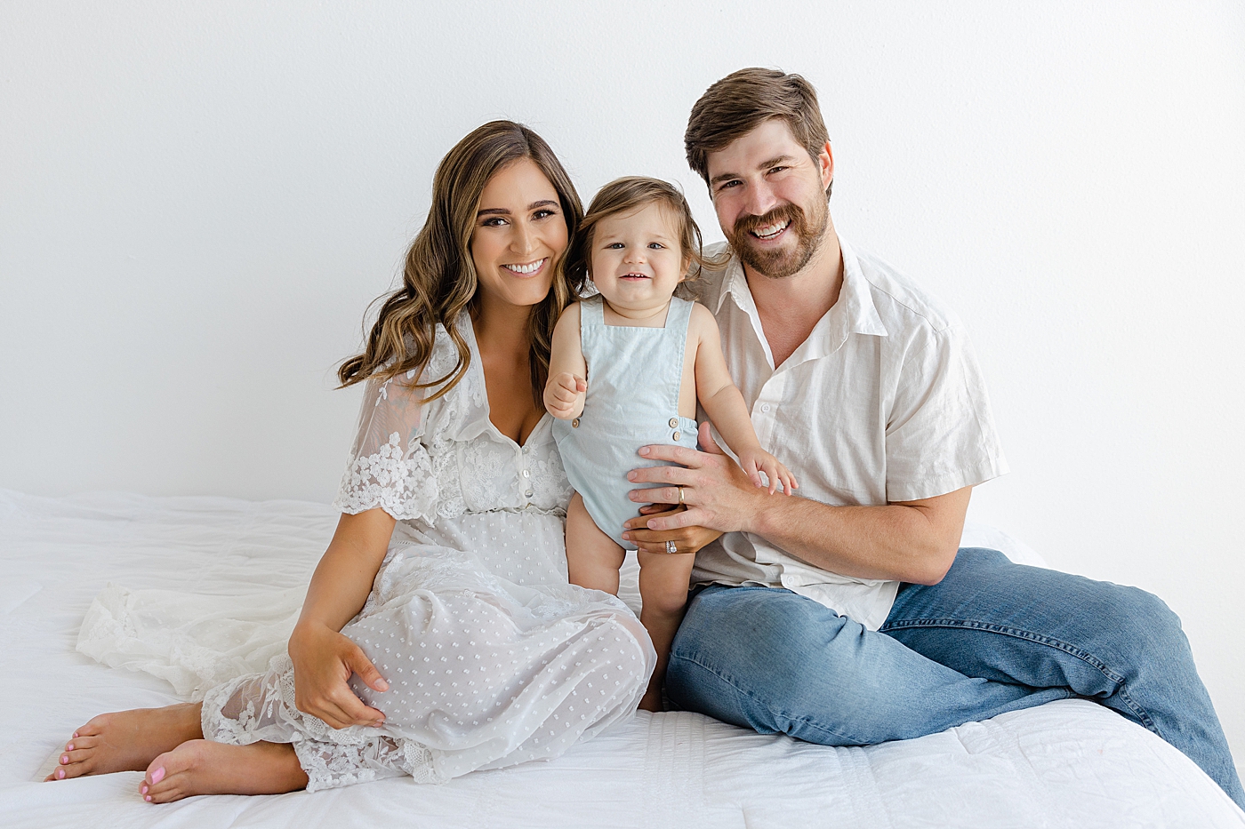 Mom dad and baby girl during their Studio Family Session | Photo by Sana Ahmed Photography