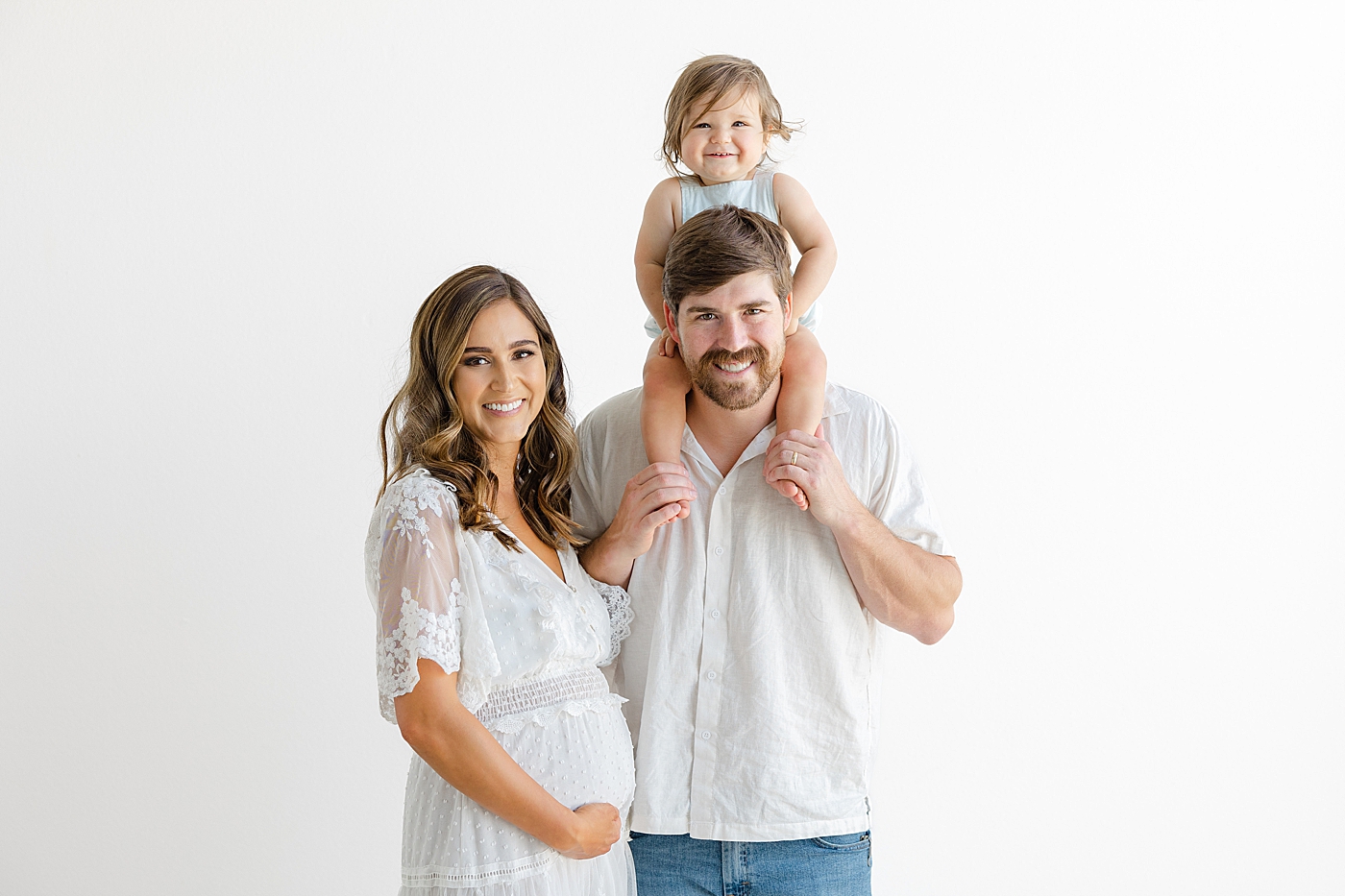 Family of three in the studio during their Studio Family Session | Photo by Sana Ahmed Photography