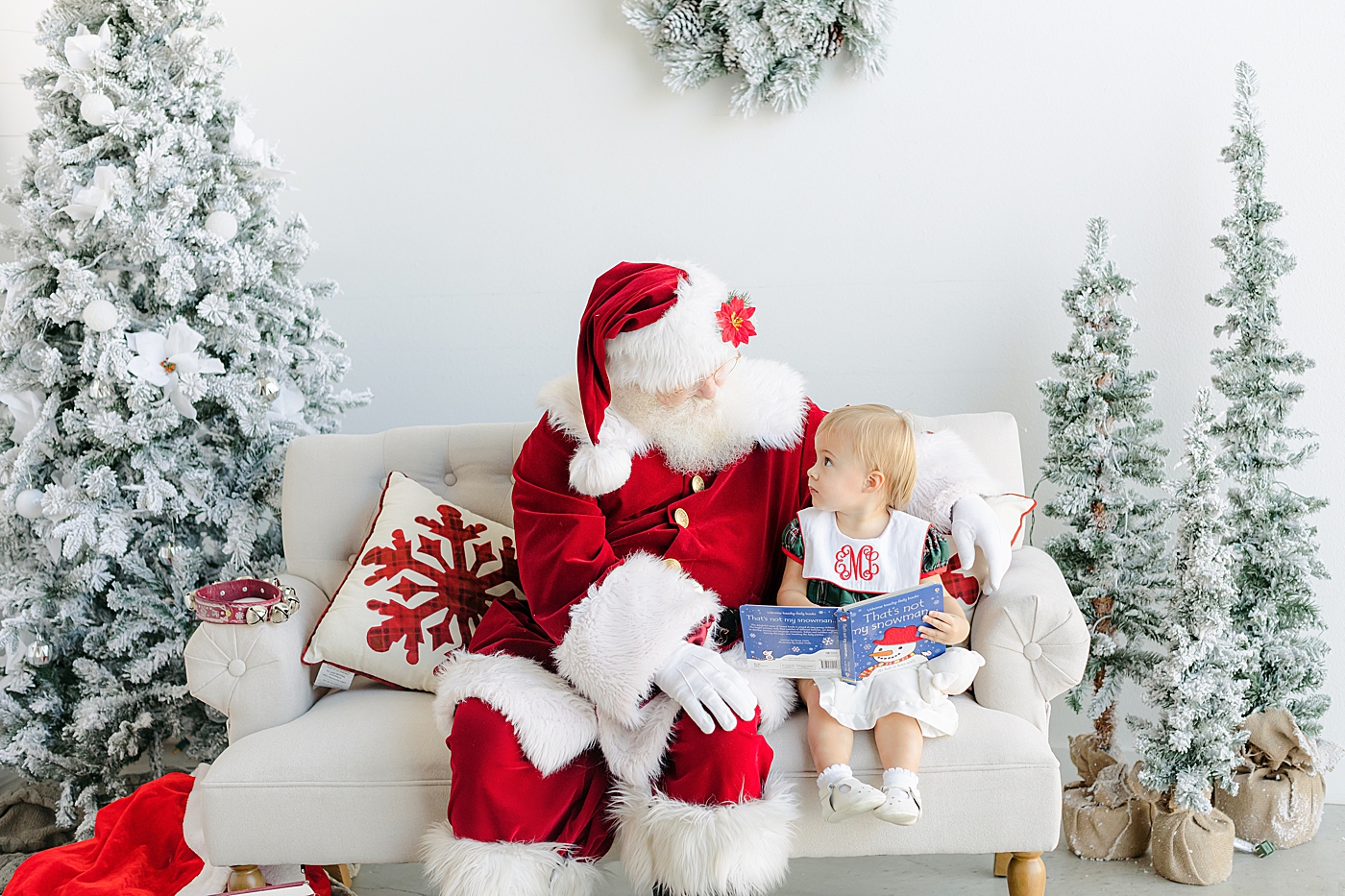 Little girl in a dress sitting with Santa | Images by Sana Ahmed Photography