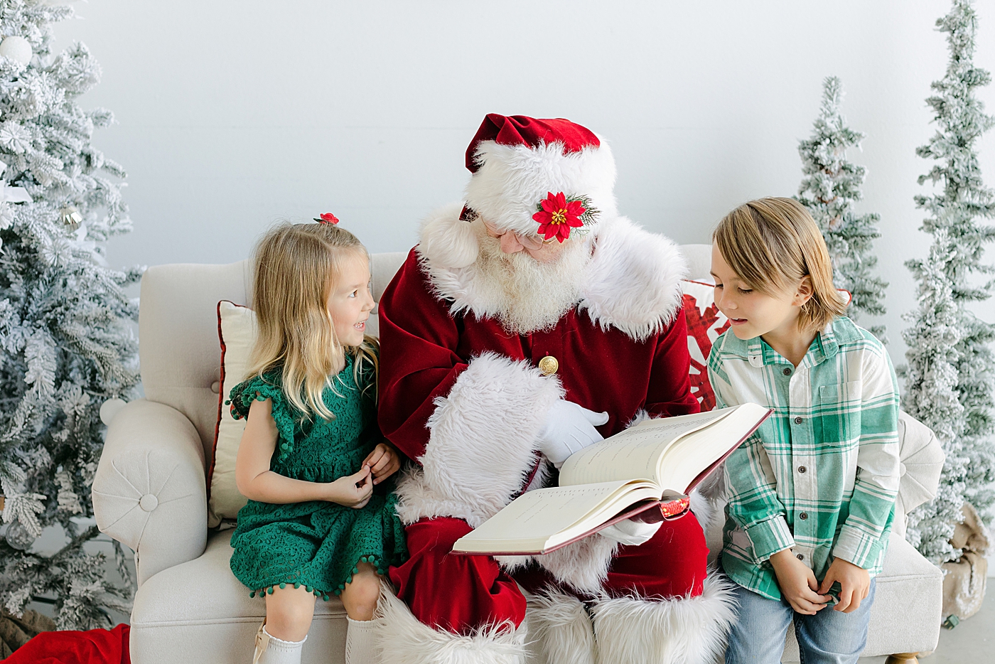 Brother and sister sitting on a couch during Santa Sessions in Austin | Images by Sana Ahmed Photography