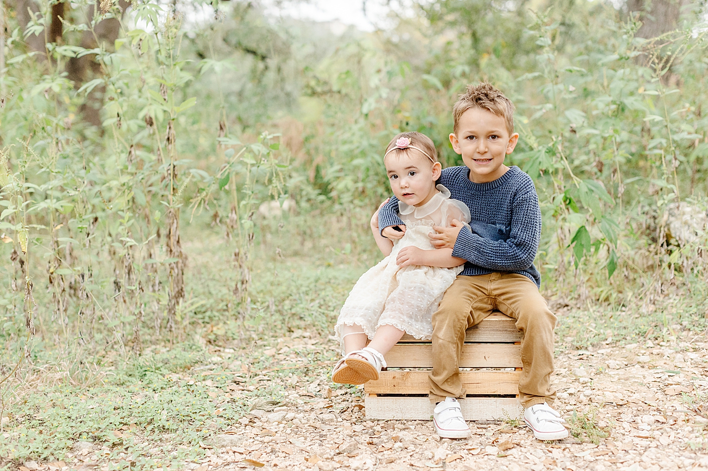 Brother and sister sitting on a box | Outdoor Family Sessions with Sana Ahmed Photography