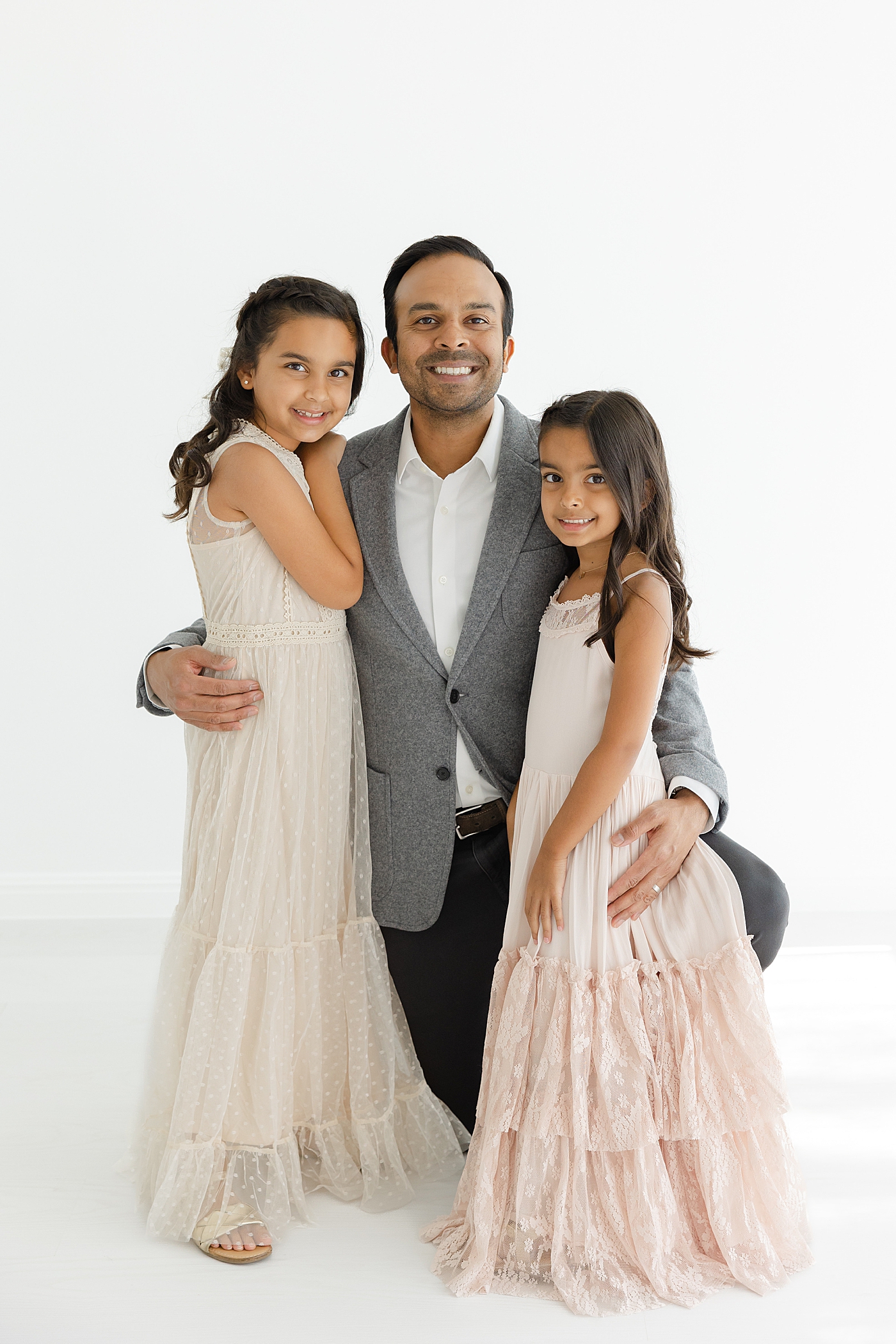 Dad with his two daughters in the studio | Image by Sana Ahmed Photography
