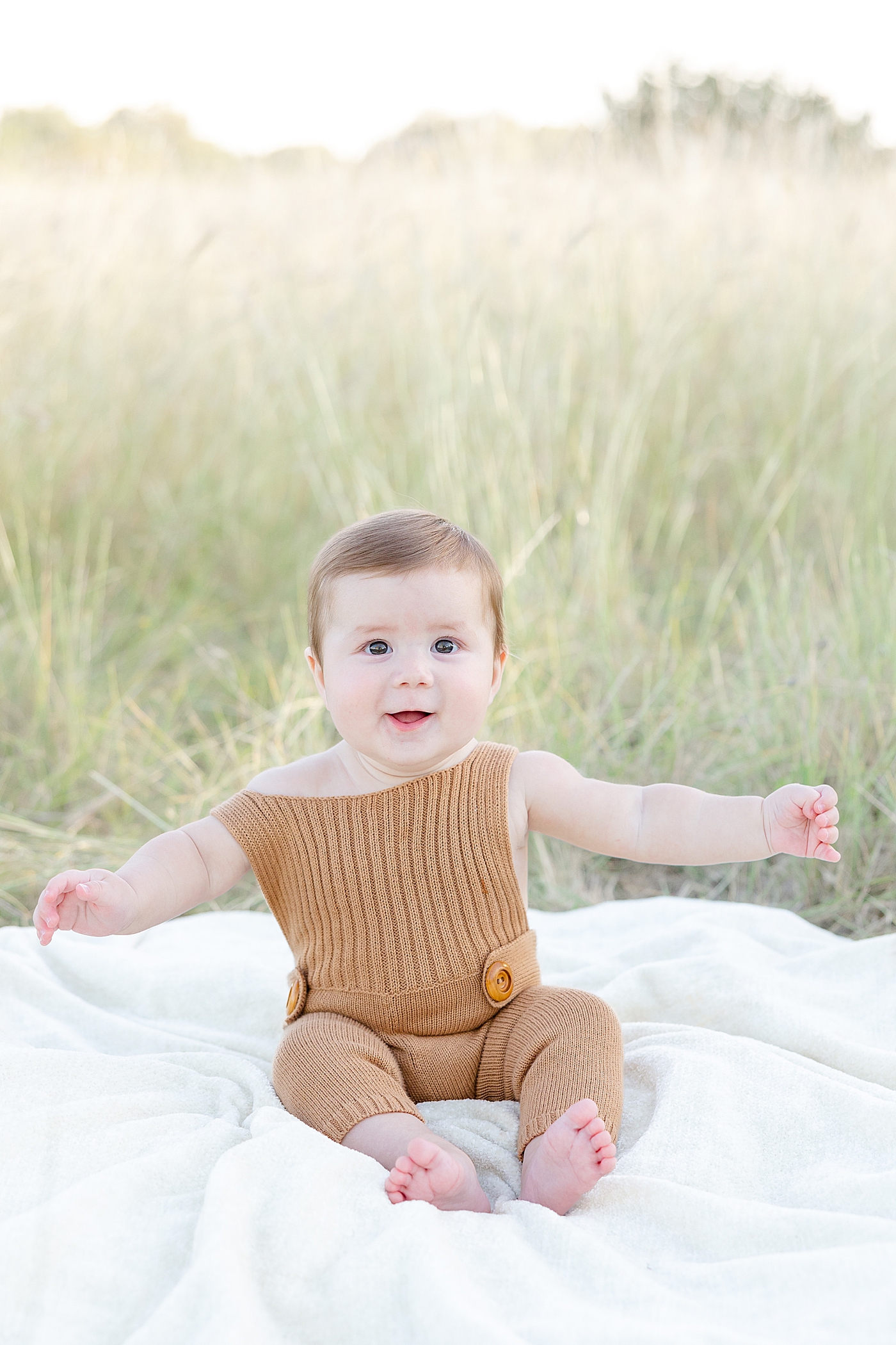 Baby boy in brown smiling | Image by Sana Ahmed Photography