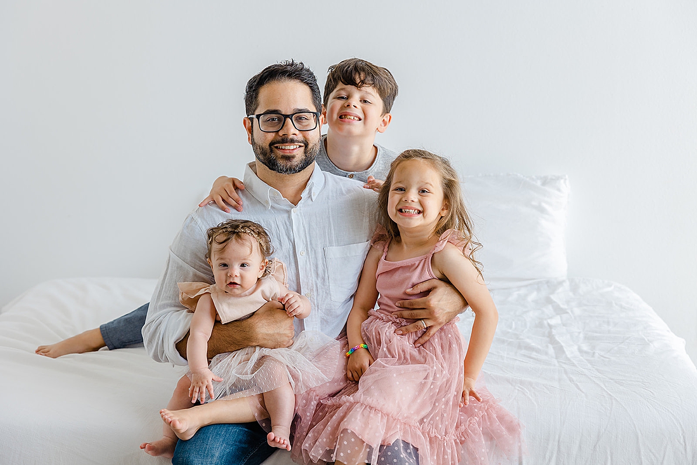 Dad sitting with his kids | Studio Family Sessions Austin with Sana Ahmed Photography