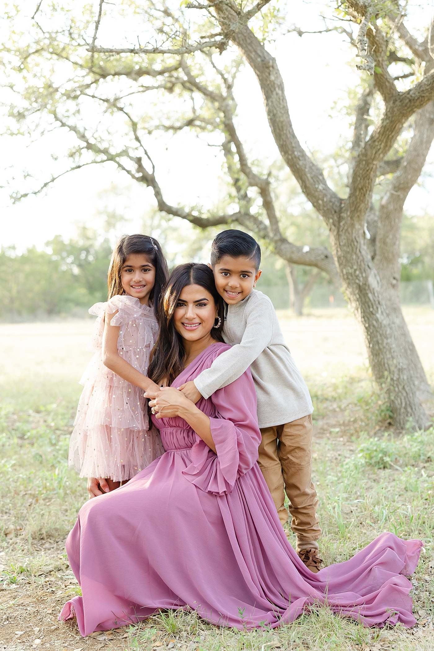 Mom with her two little ones during their Field Family Session | Image by Sana Ahmed Photography