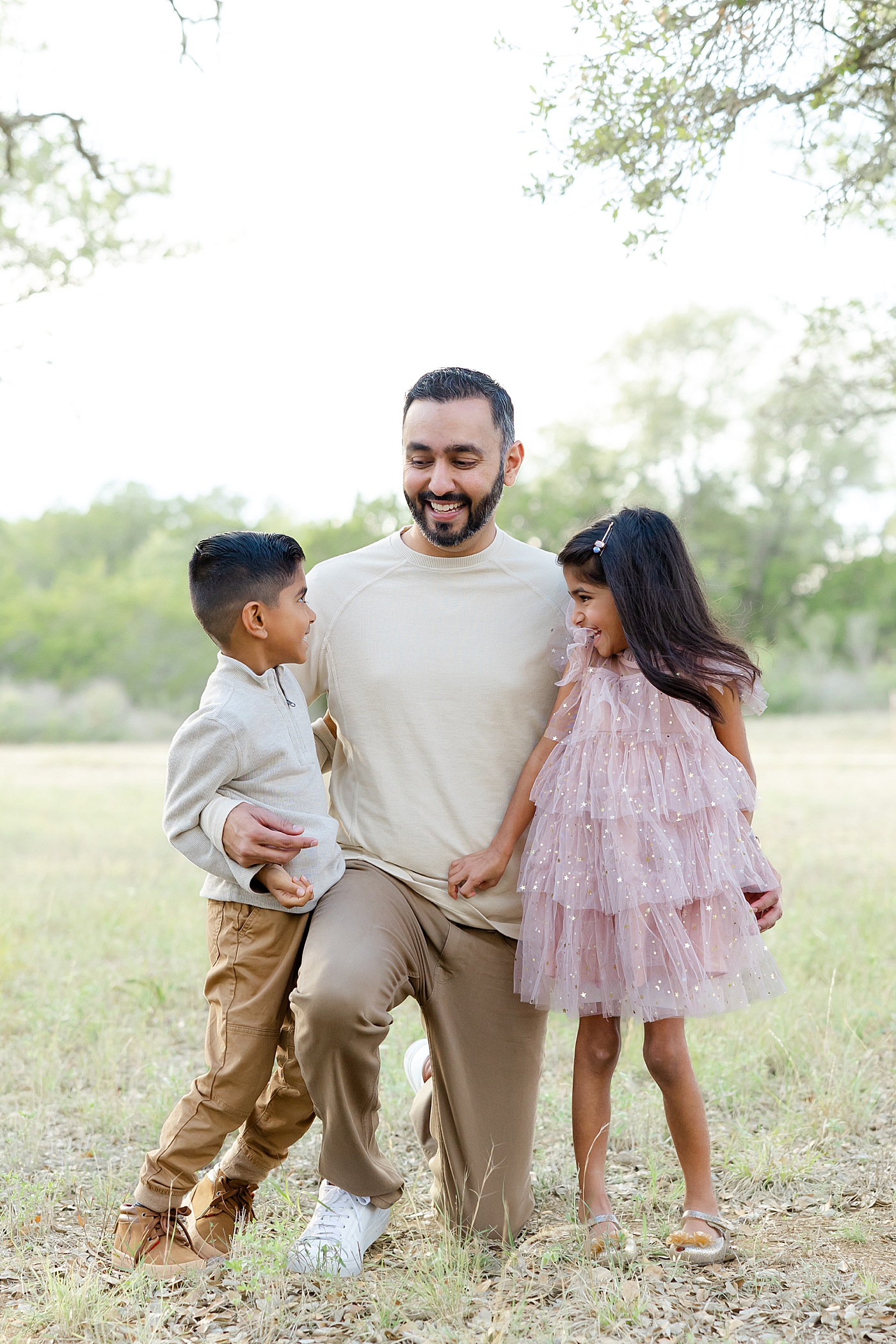 Dad with his two kids during their Field Family Session | Image by Sana Ahmed Photography