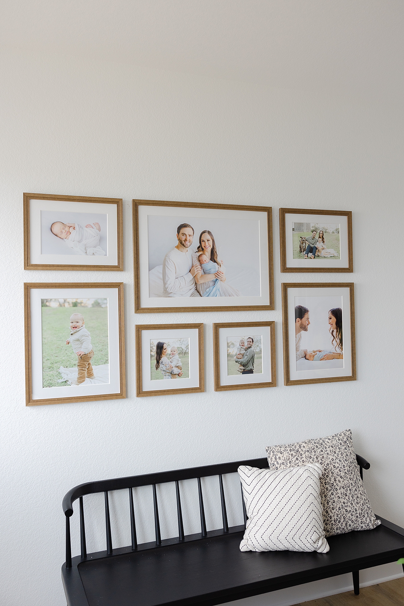 Gallery wall of family's images from their sessions | Image by Sana Ahmed Photography