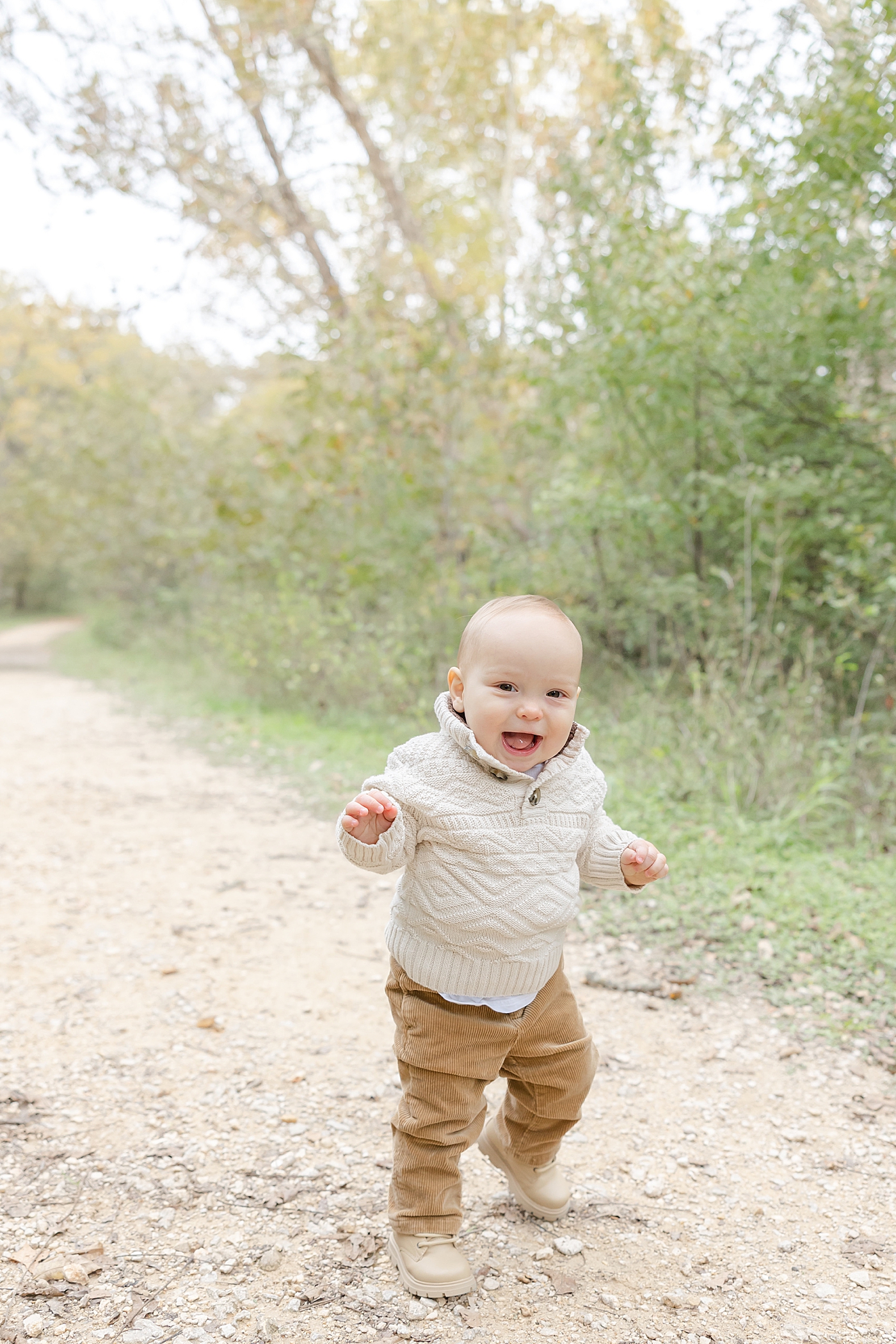 Baby boy walking during their Spring Family Sessions in Austin | Image by Sana Ahmed Photography