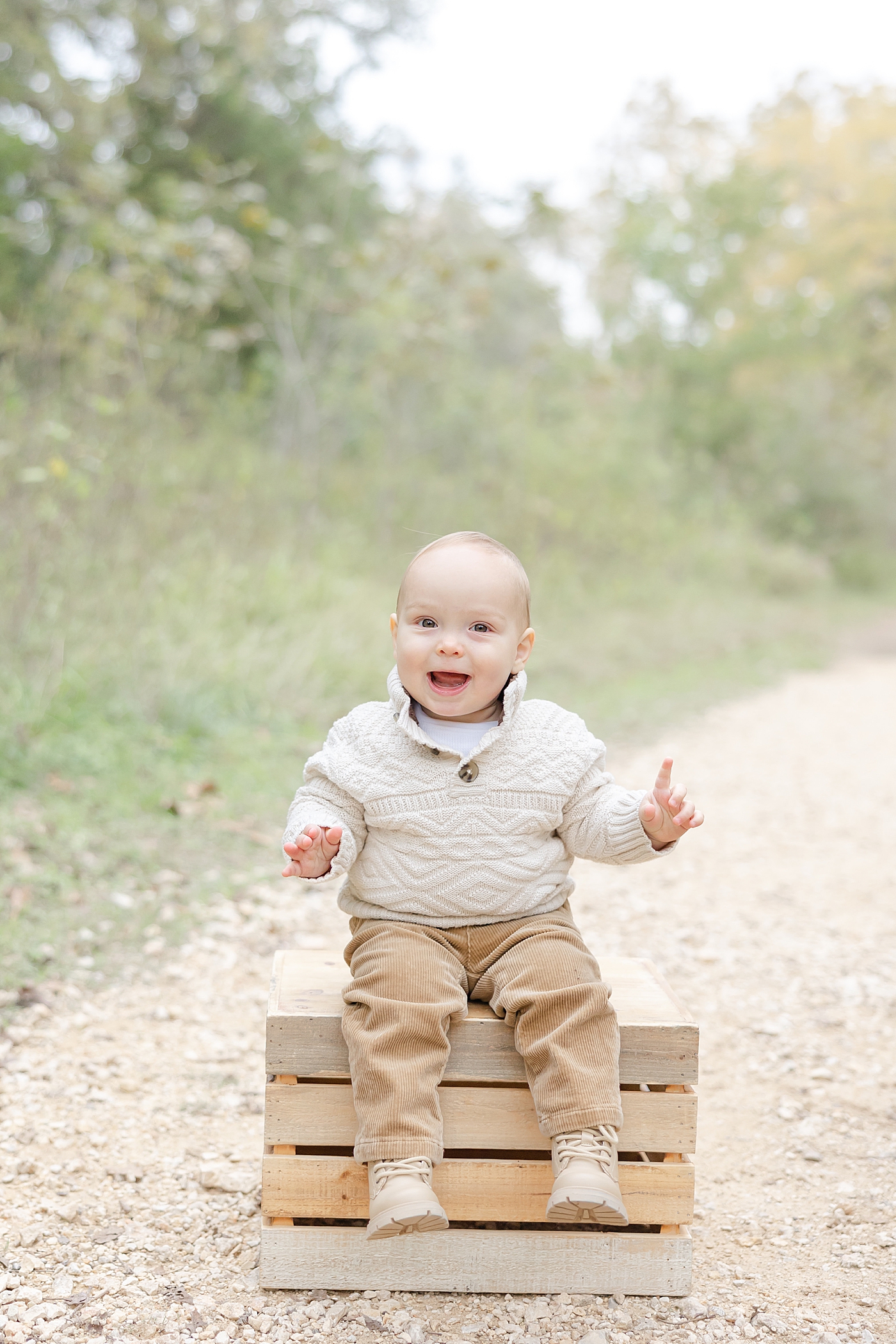Baby boy sitting on a box | Image by Sana Ahmed Photography