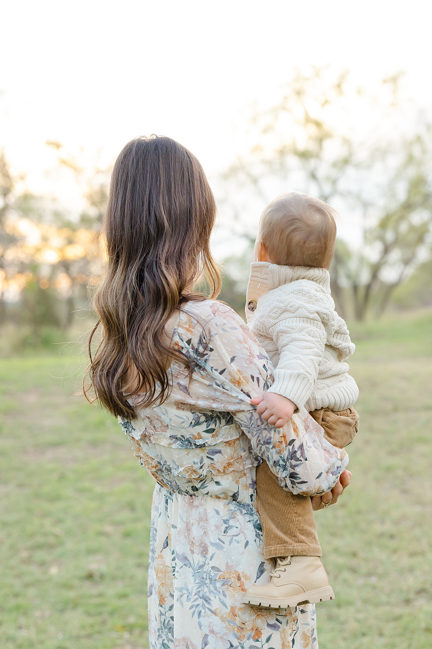 Mom holding her baby boy during their Spring Family Sessions in Austin | Image by Sana Ahmed Photography