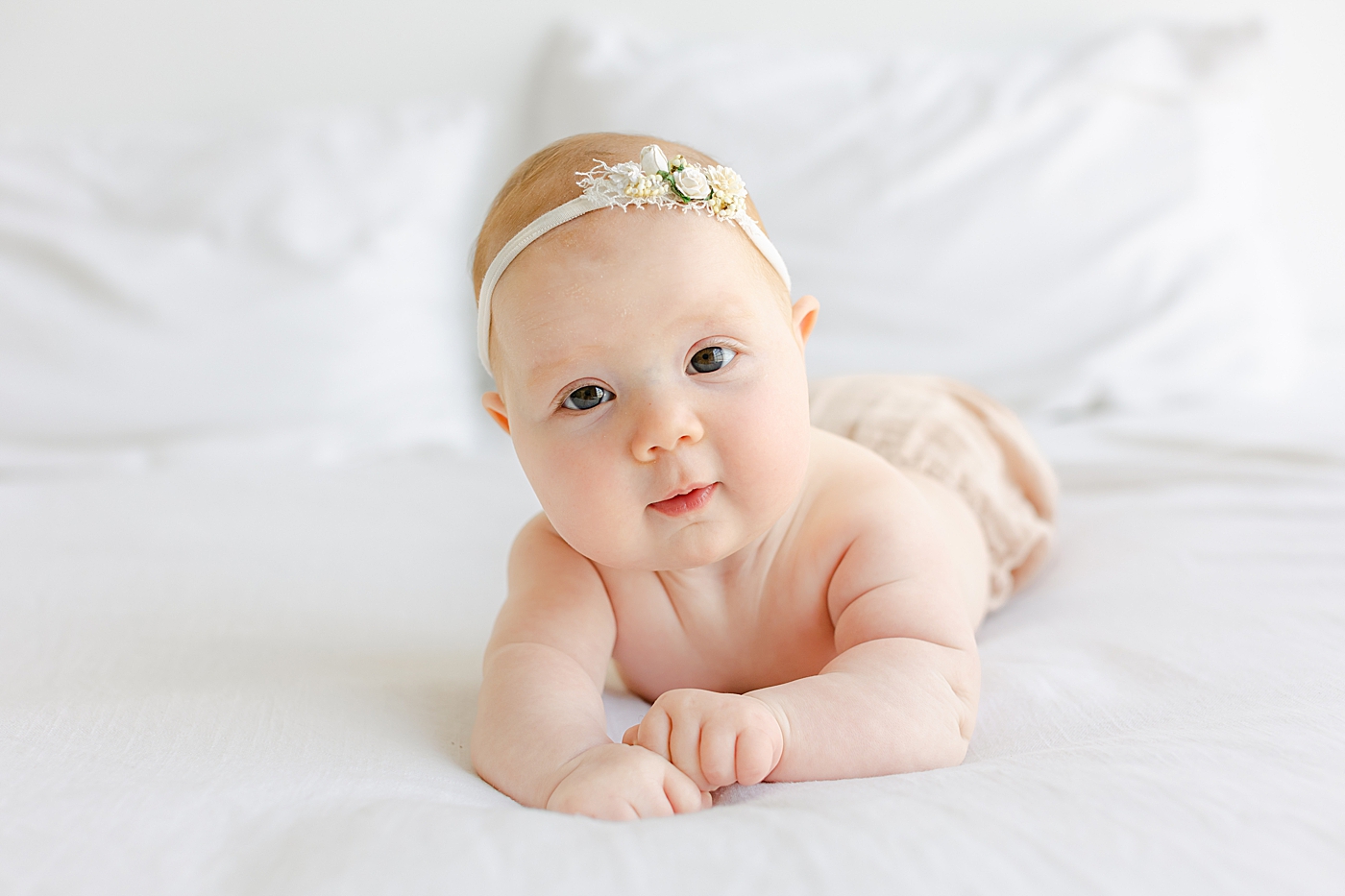 Baby girl on her tummy during her One Year Milestone Collection | Image by Sana Ahmed Photography
