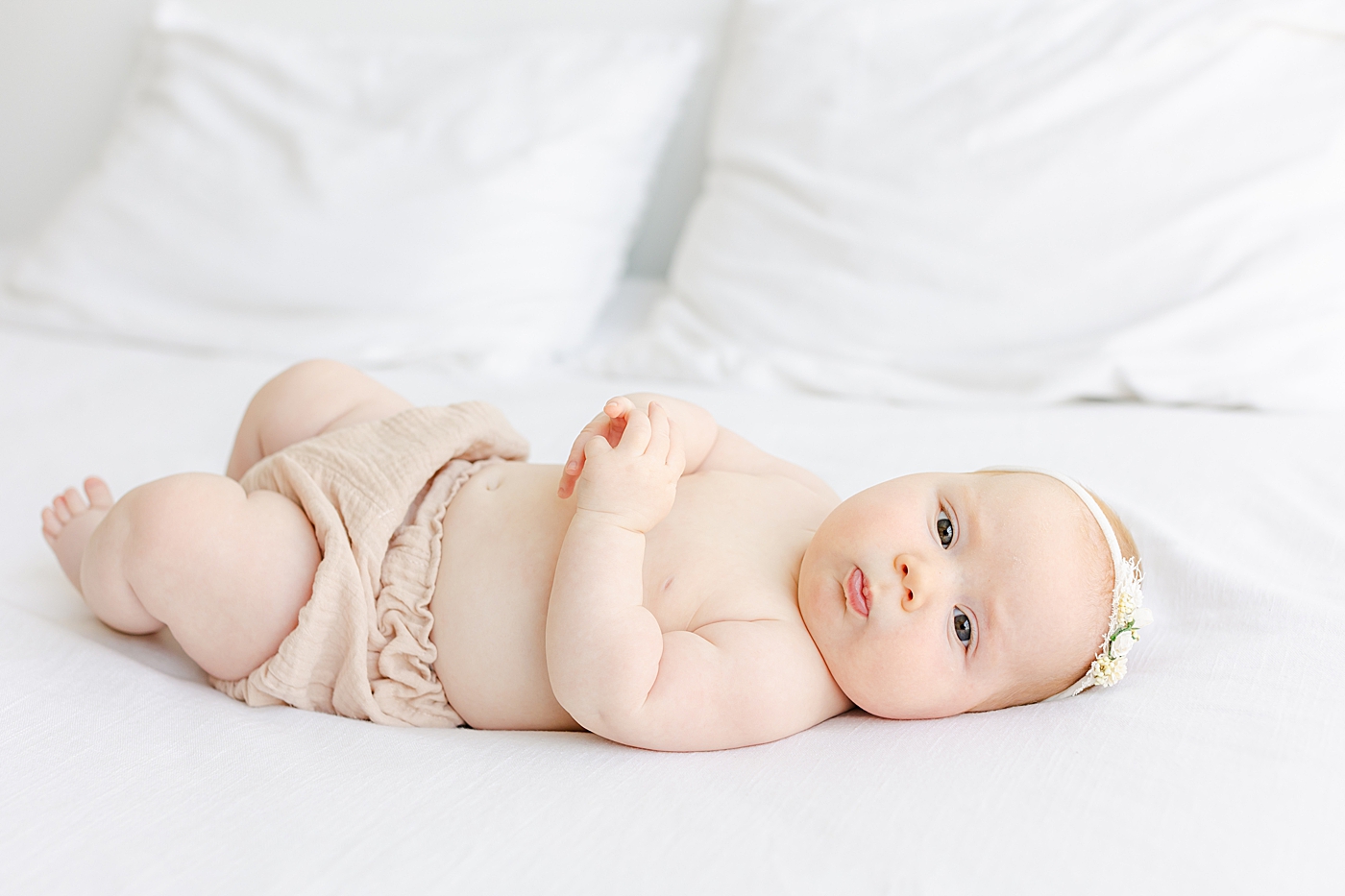 Baby girl in headband and pink bloomers | Image by Sana Ahmed Photography