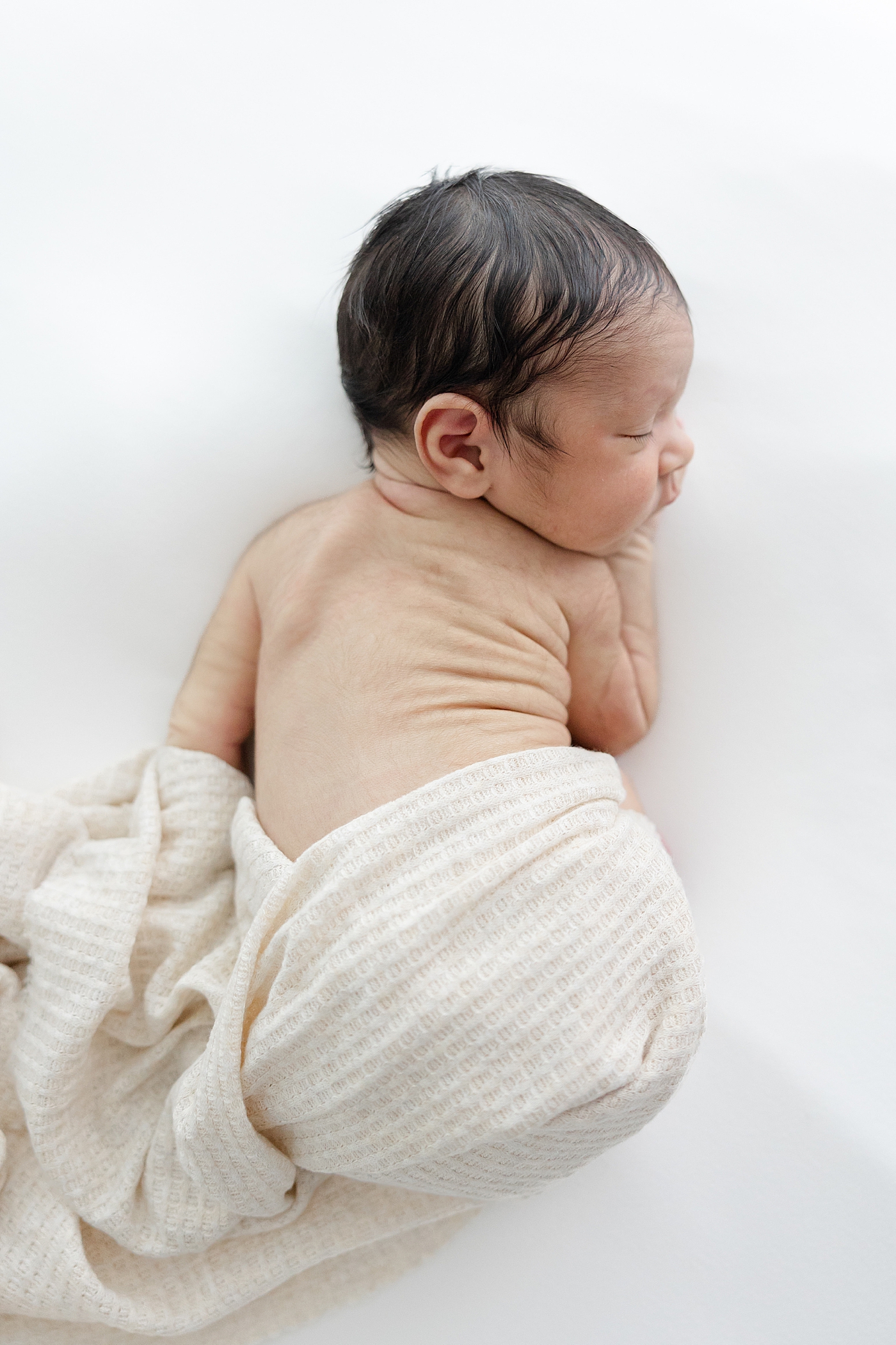 Detail of sleeping baby during his Studio Newborn Session in Austin | Image by Sana Ahmed Photography 