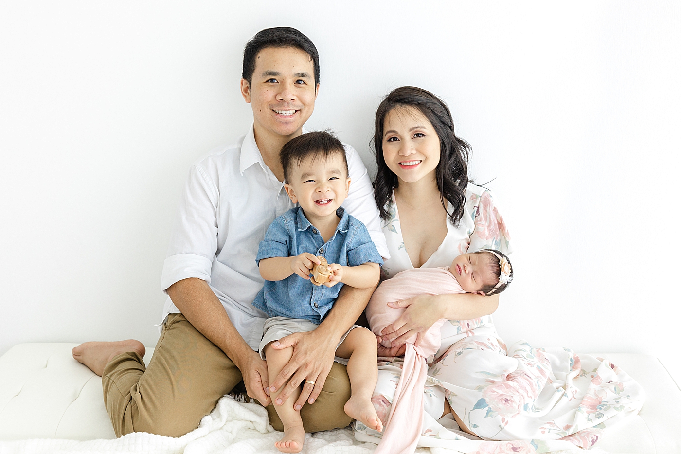 Family of four with their newborn during her Newborn sessions with siblings | Image by Sana Ahmed