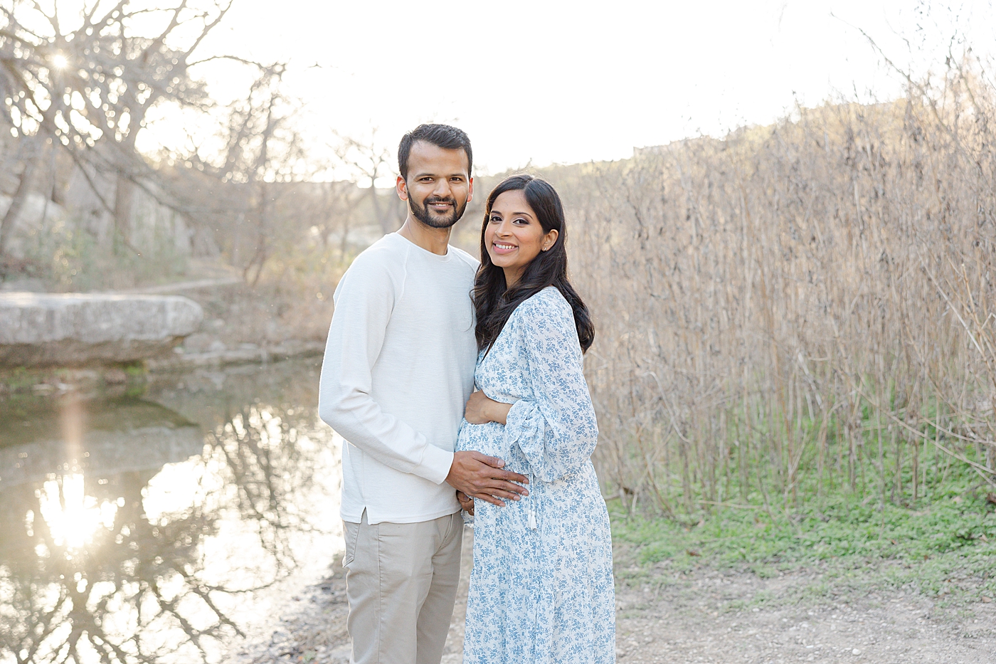Mom and dad to be smiling in the park during their Austin Maternity Session| Images by Sana Ahmed 