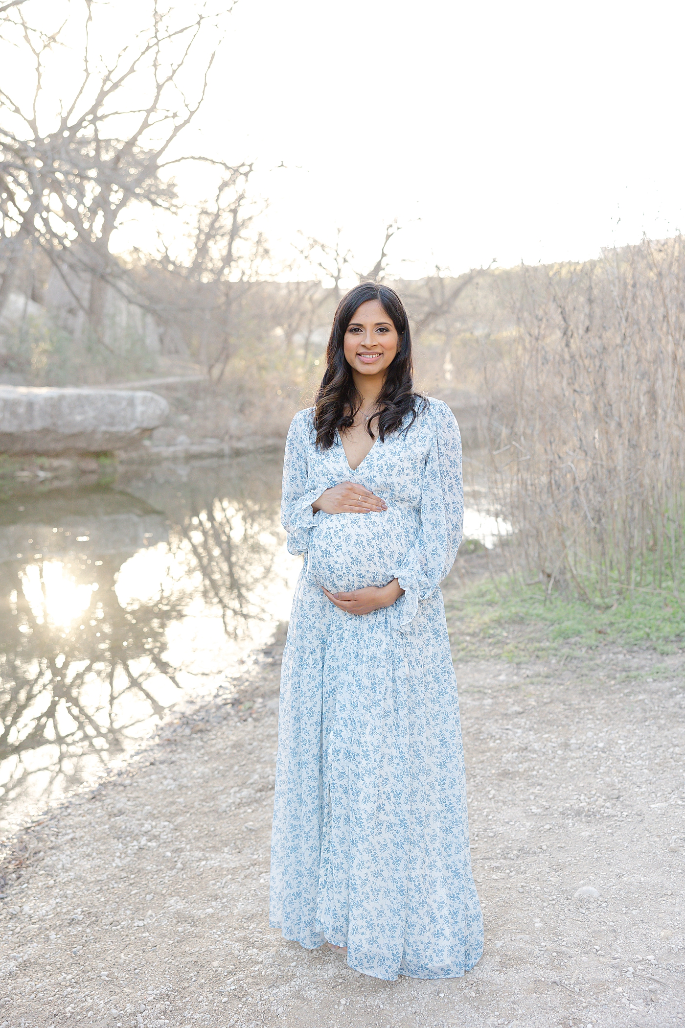 Mom to be holding her belly during their Austin Maternity Session| Images by Sana Ahmed 